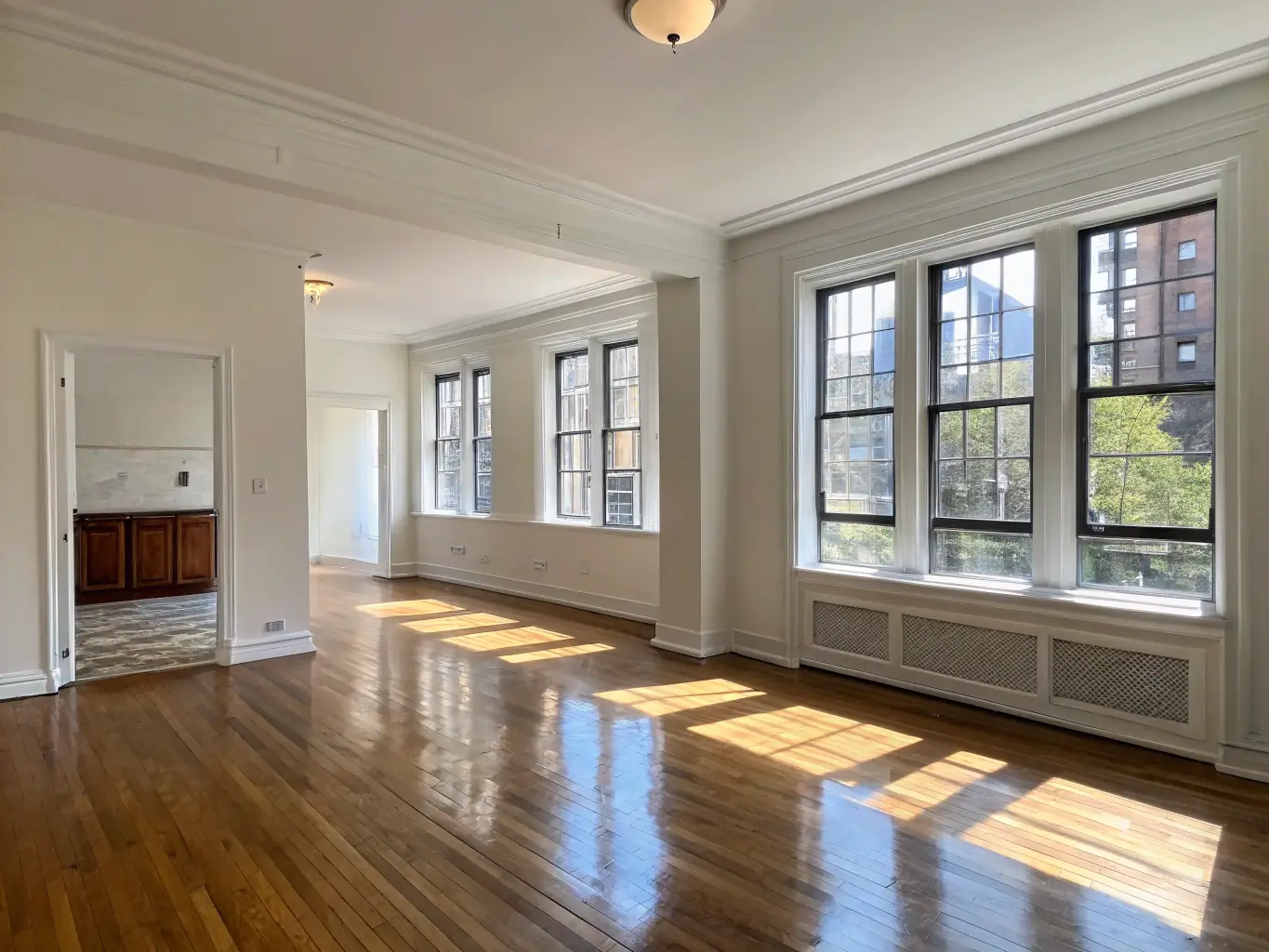 An empty apartment being cleaned after tenants have moved out, highlighting Omini Clean's move-in/move-out cleaning service.